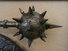 a metal object with spikes on it's head and the words captioned in russian