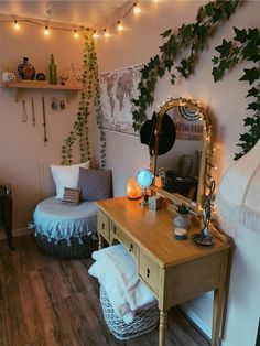 a bedroom with a bed, mirror and plants on the wall next to it is lit up by fairy lights