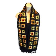 Hand Crafted Beautiful Grannycore Crochet Scarf. All-Matching Knit Neck Warmer. Handmade Sunflowers Floral Pattern Shawl, Black Background With Brown, Green, Yellow 36- Flowers Total. Wearable Art Many Occasions Multi-Functional Hair Accessory, Bag Decor, Belt, Hat Decor, Suitable For Beach, Picnic, Party, Office, Library, Shopping, Traveling, Dating, Weekends, Sports, Ideal For 4th Of July And Outdoor Activities. Fashionable And Generous, Easy To Match With Different Outfits And Styles Crochet Beach Picnic Party, Knit Neck Warmer, Granny Square Scarf, Hat Decor, Shawl Black, Knit Scarves, Color Block Scarf, Ruffle Scarf, Hand Knit Scarf