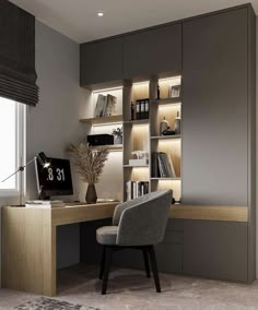 a modern home office with built - in shelving units and desk, along with a chair