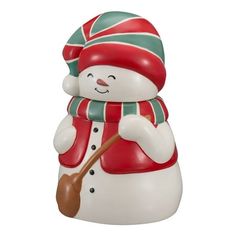 a snowman figurine with a hat and scarf holding a cane in his hand