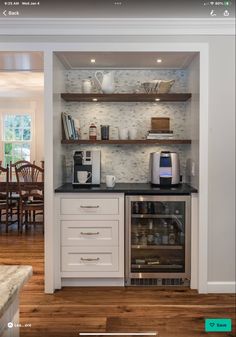 the instagram page shows an image of a kitchen with white cabinets and open shelves