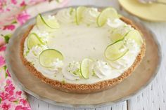 a pie with limes and cucumbers on it