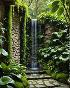 a small waterfall is surrounded by greenery and stone walkways in the middle of a garden