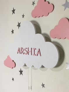 there is a cloud with the word aria on it and stars in the sky behind it