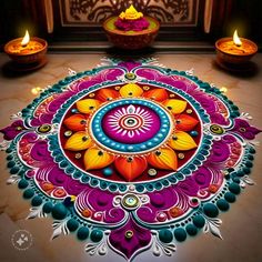 colorful rangdi design with candles on the floor