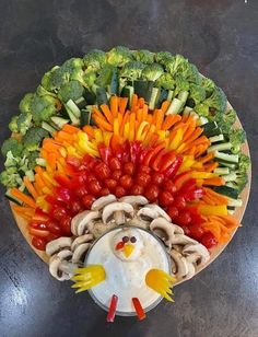 a platter filled with lots of veggies and an angry bird decoration on top