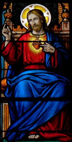 a stained glass window with the image of jesus