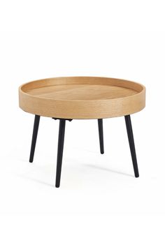 a wooden table with black legs and a round tray on it's end shelf