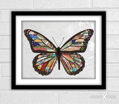 a colorful butterfly on a white brick wall