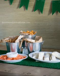 some food is laying out on the table for people to eat at their wedding reception