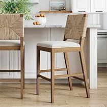 two chairs sitting in front of a kitchen counter