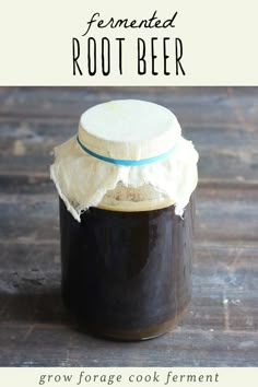 homemade fermented root beer in a mason jar on a wooden table with text overlay