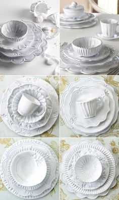 white dishes and cups are arranged on a table