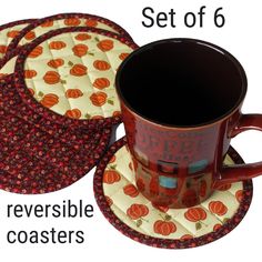 a set of 6 coasters with pumpkins on them and the words reversible coasters