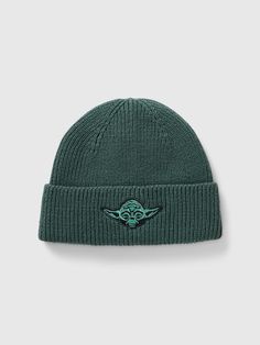 a green beanie with the star wars symbol on it