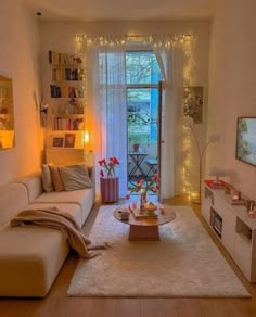 a living room filled with furniture and a flat screen tv