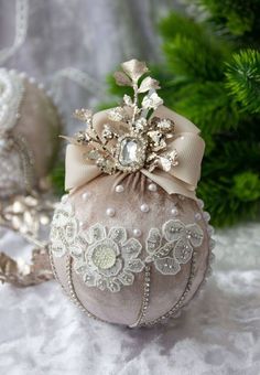 an ornament with flowers and pearls on it