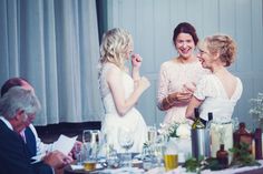 the bride and her friends are laughing at each other