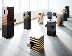 several pieces of wood sitting on the floor in an empty room with windows behind them