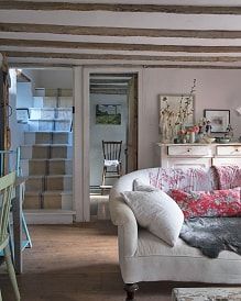 a living room filled with furniture and decor