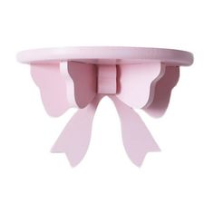 a pink bow shaped object on a white background