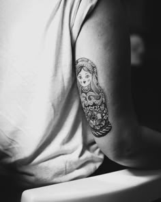 a woman with a tattoo on her arm