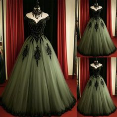 the dress is green and has black flowers on it's bust, along with an elaborate neckline