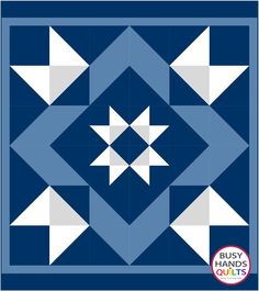 a blue and white quilt with an image of the star pattern on it's side