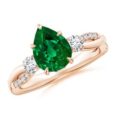 a ring with an oval green stone and two diamonds on the band, set in 18k rose gold