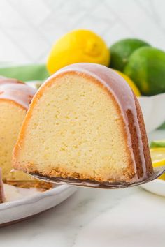 a lemon bunt cake on a plate with a slice cut out and ready to be eaten