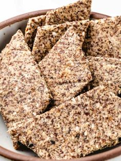 a bowl filled with crackers sitting on top of a table