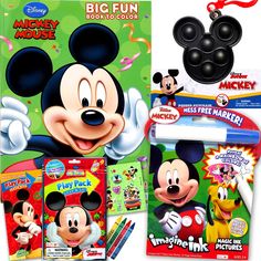 the mickey mouse coloring book and markers are on display in front of an image of mickey mouse