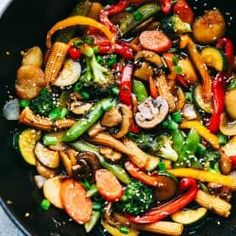 stir fry with vegetables and mushrooms in a wok