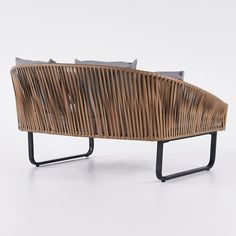 a wooden bench made out of wicker and metal