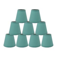 twelve teal blue lampshades are arranged in a pyramid