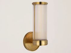 a light that is on the side of a wall with a glass tube attached to it