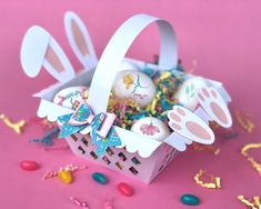 an easter basket with bunny ears and decorations