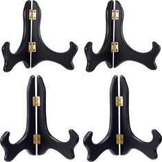 four pieces of black and gold metal hooks