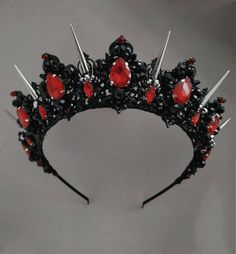 Crowns from the Exclusive Wedding Shop are always: * unique author's design * stunning detail * 100% handiwork * light weight for comfortable wearing * quality materials * large assortment for any occasion Luxurious black and red tiara. Made of black light metal and crystal and beads. This design of a black crystal tiara will ideally look like a wedding crown, a crown for an adult birthday, for a party of Heloween, for a Goth wedding. The crown height in the center is about 2 inches. Earrings le Persephone Crown, Black Halo Crown, Evil Queen Crown, Gothic Tiara, Prom Tiaras, Black Tiara, Gothic Crown, Crown Aesthetic, Goddess Crown