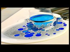 a sink with blue and white bubbles in it