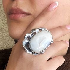 Elegant White Jewelry With Large Stone, White Cabochon Moonstone Ring In Fine Jewelry Style, Fine Jewelry White Cabochon Moonstone Ring, White Cabochon Moonstone Ring Fine Jewelry, Unique White Jewelry With Natural Stones, Modern White Crystal Open Ring, White Gemstone Open Ring, White Moonstone Open Ring, Modern White Opal Gemstone Ring