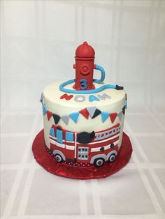 a birthday cake with a fire engine on it