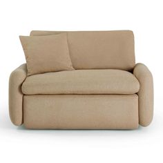 a beige couch with two pillows on the back and one arm folded over it's head