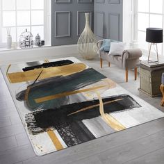 a living room with grey walls and yellow accents on the area rug is decorated in modern style