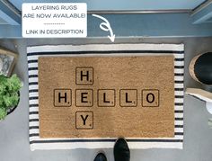 a door mat with the words hello y spelled in scrabble letters on it