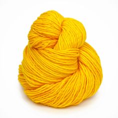 a skein of yellow yarn on a white background