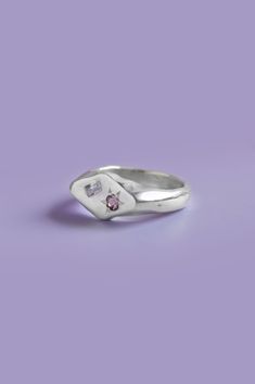 Add a pop of color to your daily style with this unique diamond-shaped signet ring. Handcrafted in sterling silver, it features a beautiful Purple and Pink Sapphire. Select your size from the drop-down to get the perfect fit.If you are unsure of your ring size refer to our size guide. Please select your ring size carefully, and reach out if you have any questions. Details925 Sterling SilverHandcrafted in our studio1x Round-cut pink Sapphire and 1x baguette-cut purple Sapphire Unique Sterling Silver Rings, Beauty In Imperfection, Purple Ring, Silver Signet Ring, Purple Sapphire, Funky Jewelry, Bling Rings, Daily Style, Pink Ring