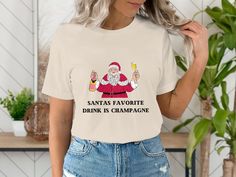 Santa Shirt, Santa's Favorite Ho Shirt, Christmas Shirt, Matching Christmas Shirt, Holiday Shirt, Gift for Him Her, Real Estate Shirt Welcome to Sip & Swag Creations, I'm so glad you're here! If you're looking for an trendy t-shirt to wear on during the holiday season! I offer Bella Canvas 3001 that are both comfortable and stylish. My t-shirt are made from premium materials and are designed to last. Each one is printed to ensure your design stays looking great wash after wash. Whether you're looking for a stylish t-shirt to lounge in, or a stylish piece to wear out, the Wine t-shirt is the perfect choice. Shop now and experience cute and comfortable t-shirts! ⋆｡o✩ All items are made-to-order. Because of the nature of these items, unless they arrive damaged or defective, I can't accept ret Santas Favorite Ho, Real Estate Shirts, Matching Christmas Shirts, Funny Christmas Tshirts, Santa Shirt, Santa Shirts, Holiday Shirt, Holiday Shirts, Trendy Tshirts