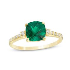 A colorful way to show your love, this engagement ring is the start of something beautiful. Crafted in warm 10K gold, this adventurous style features a 7.0mm cushion-cut lab-created verdant-green emerald flanked by a pair of sparkling diamonds. Dainty diamonds line the shank for the perfect touch of shimmer. Radiant with 1/8 ct. t.w. of diamonds and a brilliant buffed luster, this engagement ring is a unique choice to celebrate your romance. Halo Engagement Ring Wedding Band, Emerald Cut Engagement Ring, Verdant Green, Engagement Rings Vintage Halo, Emerald Cut Engagement, Gold Diamond Wedding Band, Lab Created Emerald, Diamond Engagement Rings Vintage, Emerald Engagement Ring Cut